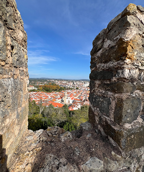 Village in Portugal looking down from castle walls. 
